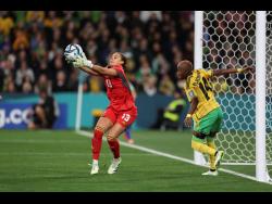 Jamaica’s goalkeeper Rebecca Spencer pulls in a ball in front of teammate Deneisha Blackwood during the FIFA Women’s World Cup Group F match between Jamaica and Brazil in Melbourne, Australia, Wednesday, August 2, 2023.