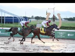 FUNCAANDUN (right), ridden by Robert Halledeen, winning the seven furlong, three-year-old and upwards open allowance graded stakes Phillip Feanny OD Gold Cup ahead of IS THAT A FACT (Tevin Foster) at Caymanas Park on Saturday, October 5. FUNCAANDUN is set for a fifth consecutive win.
