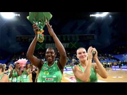 Jamaica and West Coast Fever goal shooter Jhaniele Fowler (left) thanks the crowd after breaking the regular season scoring record in a Suncorp Super Netball League game against the Adelaide Thunderbird in 2022.