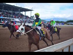 SUPREMASI (right), ridden by Tevin Foster, wins the Mayberry Gold eighth race over seven  furlongs at Caymanas Park on Saturday, December 7, 2024.