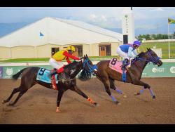 ACKNOWLEDGEME (right), ridden by Dick Cardenas, winning the MASTER BLASTER Trophy ahead of FLYBLUEJET (Javaniel Patterson) over five furlongs straight at Caymanas Park on Sunday.