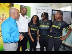 From left: President of the Jamaica Olympic Association (JOA) Christopher Samuda and President of the Jamaica Lacrosse Association Calbert Hutchinson with members of the Jamaica Lacrosse team, Patricia Walters, Shannen Graham and Jhanae Bravo, during a press conference at the JOA office to highlight the lacrosse team.