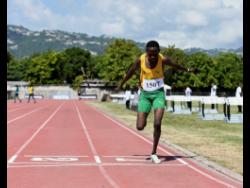 Ryan Achau of St. Jago High School comes home a lonely winner in the Class One boys’ 1500 metres at the McKenley/Wint Invitational Meet at Calabar High School on Saturday. Achua win in 3:54.51.