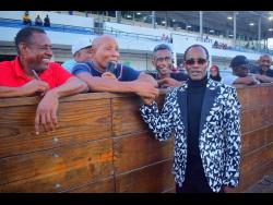 Legendary rider Trevor ‘Slicer’ Simpson is greeted by turfites at Caymanas Park, where he was on hand to witness the race named in his honour, The Trevor ‘Slicer’ Simpson OD Trophy, which was run over five furlongs round at Caymanas Park on Saturday. CALIFORNIA CROWN, ridden by Robert Halledeen, won the event.