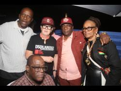 British DJ David Rodigan (second left),  shares lens with (from left) DiMario McDowell, Kenneth ‘Skeng Don’ Black , Maxine Stowe and George Johnson (seated) at Thompson’s 60th  birthday party held Saturday, at Tranquility Gardens, Dunn’s River Park, St Ann.