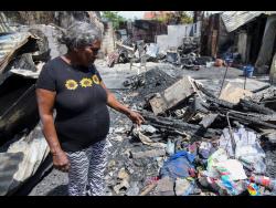 Beatrice Williams surveys the rubble, struggling to come to terms with the fire that left her family homeless.