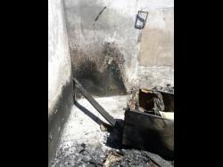  The burnt-out home where Olganese Chambers-Taylor died in her living room on March Pen Road, Spanish Town, St Catherine.
