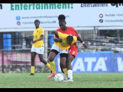 Krysten Watson (right) of UWI Women’s Football Club and Latoya Sanchez of Frasziers Whip battle for the ball during a Jamaica Women’s Premier  League match at the Anthony Spaulding Sports Complex on March 1. 