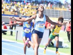 Tashana Godfrey of  Edwin Allen High celebrates after winning the Class Four Girls’ 70 metres hurdles final at the ISSA-GraceKennedy Boys and Girls’ Athletics Champions last year. 