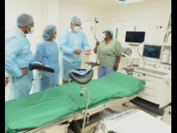 Credit: Ian Allen/Photographer Minister of Health and Wellness, Dr Christopher Tufton (second right), tours one of the four refurbished operating theatres at Kingston Public Hospital (KPH) on Friday, accompanied by Dr Lindberg Simpson (left), head of surgery at KPH; Joan Walker-Nicholson (second left), director of nursing services; and Joan Taylor-Henry (right) from the department of nurse management.