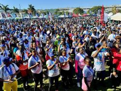 Credit: Ashley Anguin Participants in the ninth Jill Stewart MoBay City Run enjoying the early-morning festivities at Harmony Beach Park in Montego Bay on Sunday.