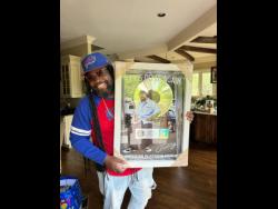 Credit: Contributed Gramps Morgan shows off his platinum plaque for his work on J Boog’s ‘Let’s Do It Again.’