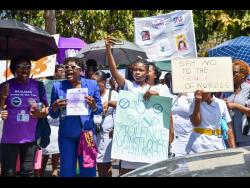 Protesters make their voices heard as they decry violence against women during a march yesterday in sections of the Corporate Area.