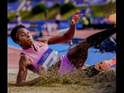 Jamaica’s Shanieka Ricketts lands in the sand after a triple-jump attempt at the Boris Hanžeković Memorial meet in Zagreb, Croatia, on May 24.