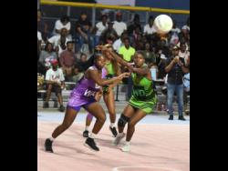 Credit: Ian Allen Phoyos Zaudi Green (right) of Manchester Spurs and Tasheka Reid (left) of St Ann Orchids compete for a loose ball during the Elite Netball League playoff match at the Leila Robinson Courts on Sunday.