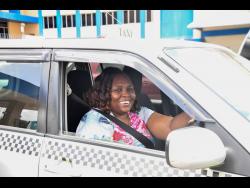 Credit: Photos by Matthew McKoy/Photographer Elaine Jackson navigates Kingston’s chaos with grace and wisdom.