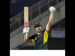 Australia’s Cameron Green celebrates after reaching his 50 in the opening T20 International against the West Indies at Sabina Park last night. 