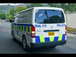 Police on the scene of yesterday’s shooting in Jacks Hill, St Andrew.