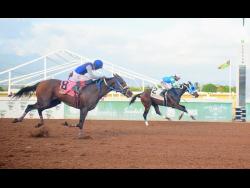 BOB THE BUILDER (right), ridden Shane Ellis, winning the TERREMOTO Trophy over 9 1/2 furlongs at Caymanas Park on Saturday, July 19.