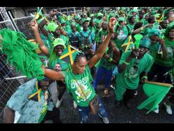 Jamaica Labour Party supporters in a jovial mood at Sunday’s mass rally in Half-Way Tree, St Andrew.