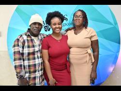 Sagicor Foundation Scholarship awardee Daynea Lewis (centre) with her proud parents Denton and Althea.