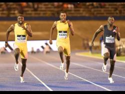 Jamaica’s Oblique Seville (right) winning the men’s 100 metres in 9.82 seconds ahead of the United States’ Noah Lyles (left), 9.85, and Great Britain’s Zharnel Hughes (centre), who was fourth in 10.09, at the Racers Grand Prix inside the National Stadium.