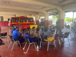 Some firefighters gathered after the meeting at the York Park Fire Station was called off yesterday. 