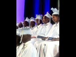 Mylon McCalla (third right) cannot hide his excitement during his graduation ceremony.
