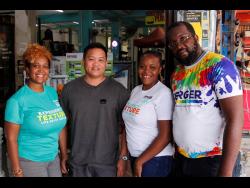 Ryan Chung (second left), managing director of Wilson Chung Hardware, is flanked by Berger Paints Jamaica representatives — Jody-Ann Jones (left), area sales manager – Eastern; Tamara Thomas (second right), trade marketing officer; and Ahmad Fitzgerald, sales associate — at the final leg of the Trowel-On Roadshow in St Thomas.