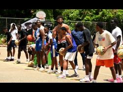Denver Nuggets’ Jamal Murray (centre) instructing student-athletes about  basketball drills during the Jamal Murray Basketball Camp at Mount Alvernia High on Sunday, September 7.