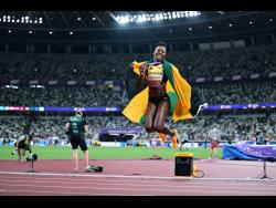 Shericka Jackson celebrates the bronze medal she won in the women's 200 metres at the World Athletics Championships inside the Japan National Stadium earlier.