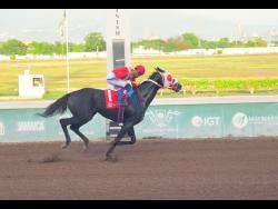 SUPERNATURAL POWER, ridden by Raddesh Roman, wins The Thunderbird Trophy over seven furlongs at Caymanas Park on Saturday, September 13.