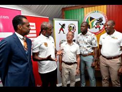 Alfred ‘Frano’ Francis (second left), race director of Reggae Marathon, chats with (from left) Dr Carey Wallace, executive director, Tourism Enhancement Fund; Glendon Nam, past president of Jamdammers Running Club; Kemroy Johnson, president of Jamdammers Running Club; and Ian Kelly, chairman, Reggae Marathon, during the 2025 Reggae Half Marathon, 10K and 5K media launch at S Hotel in St Andrew on Wednesday night.