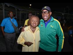 Sports Minister Olivia Grange with JAAA Vice President Ian Forbes (right).