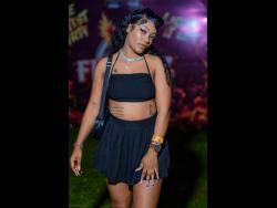 Self-employed Tish Simms matches the mood at Flamez with a crop top and pleated mini skirt.