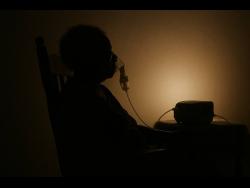 The elderly woman from Crawle River, Clarendon, relies on a nebuliser to breathe, but the absence of electricity has made it impossible for her to use the life-saving machine.