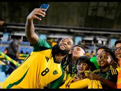 Credit: Gladstone Taylor Reggae Boyz midfielder Kasey Palmer takes a selfie with fans at the Jamaica vs Cuba Group B, League A Concacaf Nations League football match at the National Stadium on Friday, September 6, 2024. The game ended 0-0.