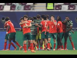 Portugal players celebrate a goal during the FIFA U17 World Cup final soccer match against Austria in Doha, Qatar on Thursday.