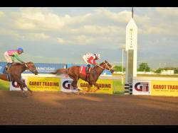 CALIFORNIA CROWN, ridden by Robert Halledeen, wins the Kaz Hosay Trophy ahead of ZULU WARRIOR (Raddesh Roman) over five-and-a-half furlongs at Caymanas Park on Saturday.