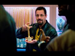 This image released by A24 shows Adam Sandler in a scene from “Uncut Gems.”  
