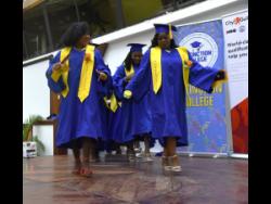 Ian Allen/Photographer 
Members of the Distinction College graduating class of 2025 march onto the stage during the ceremony at the Jamaica Conference Centre in downtown Kingston on Sunday.