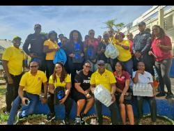 Members of the Friends of Region 6 are joined by Jamaica Constabulary Force personnel and educators during a recent visit to the Brampton Primary and Infant School in St Elizabeth. 