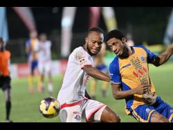 Rohan Brown (left) of Portmore United and Harbour View’s Stephen Young challenge for the ball during their Jamaica Premier League football match earlier this season.