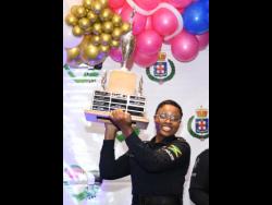 Corporal Shantel Powell celebrates after being named top cop at the LASCO JCF Saluting Our Heroes Awards ceremony yesterday at The Jamaica Pegasus hotel.