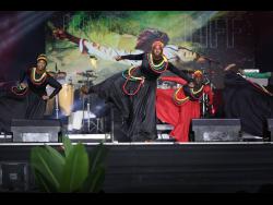 Members of the Tivoli Gardens Dance Troupe pay tribute to Jamaica Cliff.