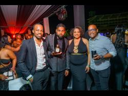 From left: Red Stripe’s Lasana Wilson links up with entertainment boss Romeich Major; Brand Manager Nadine Hylton; and Head of Commerce Sean Wallace.