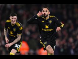 Credit: AP Manchester United’s Matheus Cunha (right) celebrates scoring his side’s third goal during the English Premier League soccer match against Arsenal in London, England, on Sunday. Man United won 3-2.