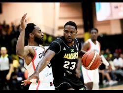 Canada’s Aaron best stays close to Jamaica’s Tyran De Lattibeaudiere in action from the FIBA World Cup basketball qualifier at the National Indoor Sports Centre last night. Canada won 97-81.