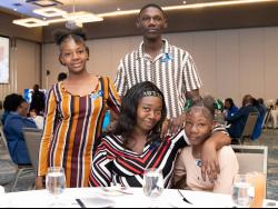 Family members of late trainee constable Desmond Thompson.