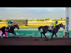 NEO STAR (right), ridden by Tajay Suckoo, wins the second running of the nine-furlongs-and 25-yard International Women’s Day Trophy ahead of  DON KWESI at Caymanas Park on Saturday.